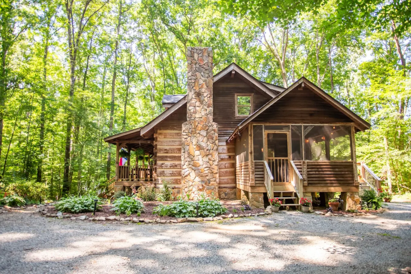 Partner log cabin with a stone chimney in the forest