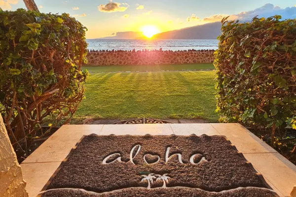 Oceanfront lawn at sunset at a partner property in Hawaii